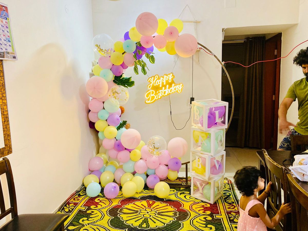 Multi colour balloon decoration with baby box 