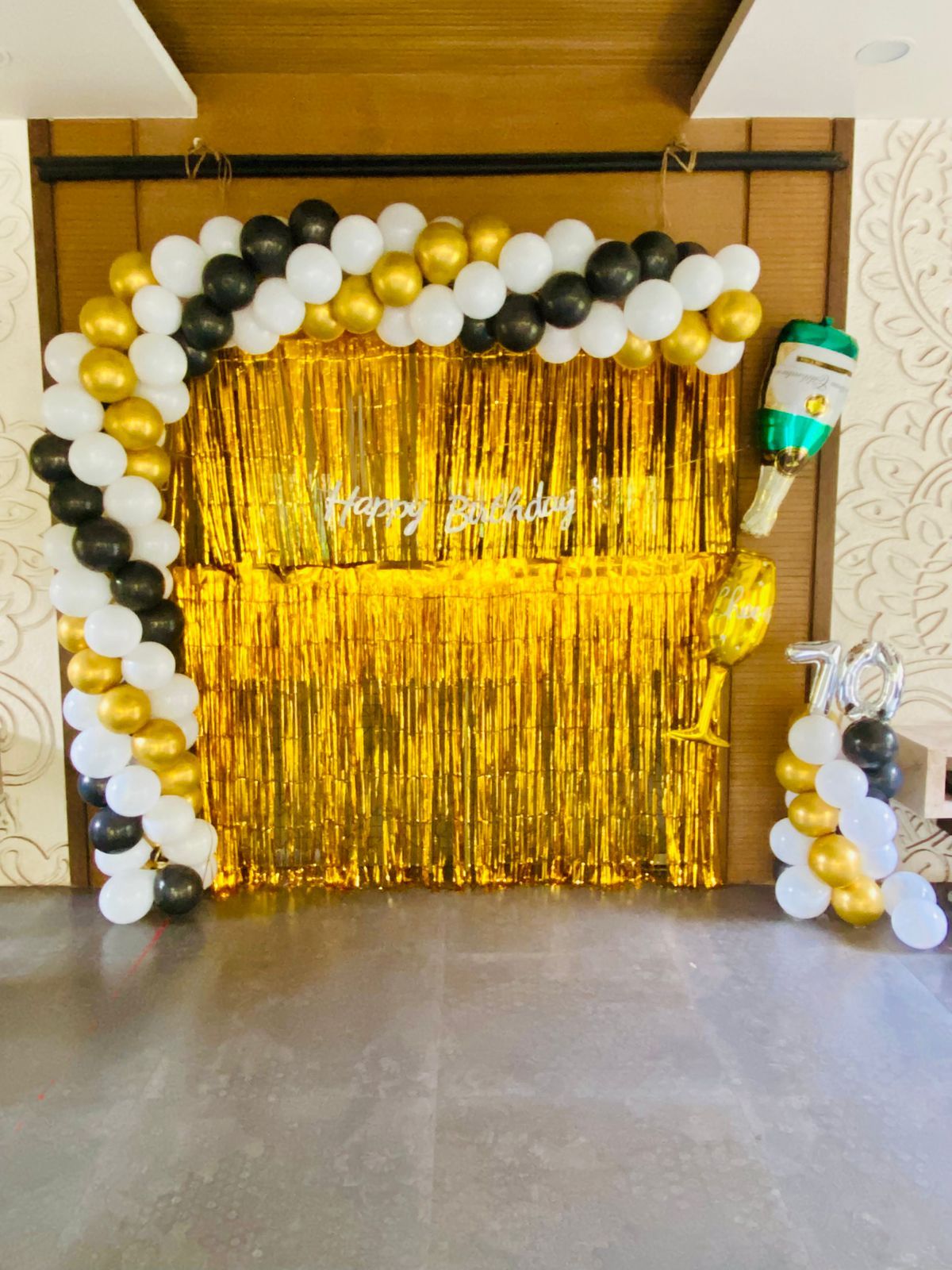 Golden, white and black balloon decoration arch 