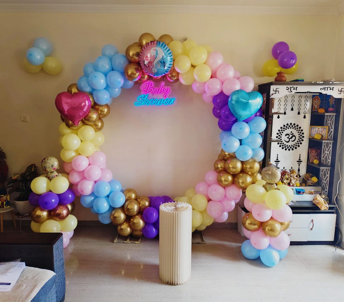 Baby shower decor on ring stand with cake table 