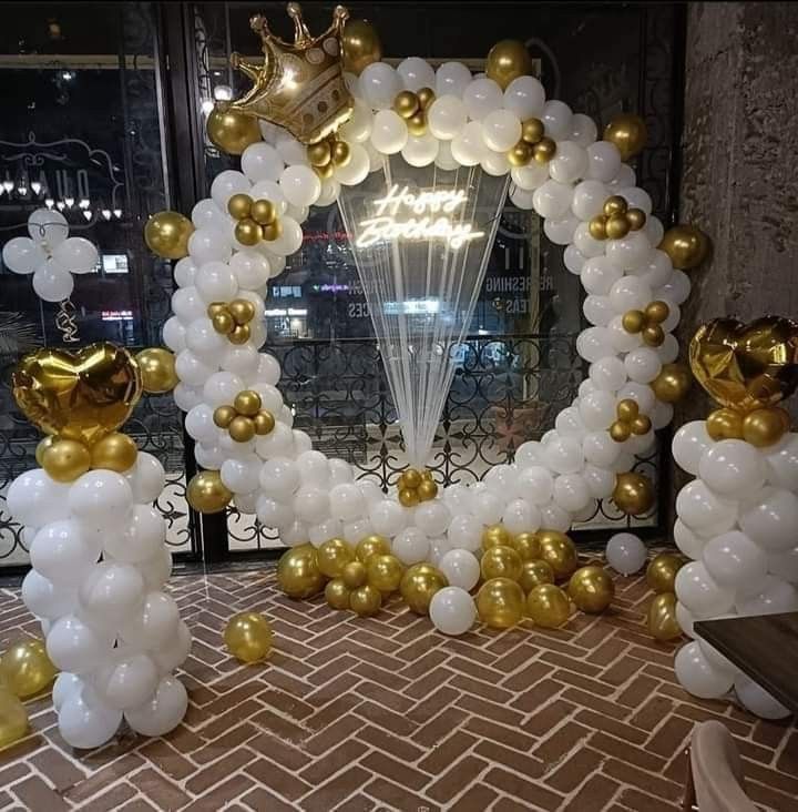 White and golden balloon decoration with ring stand 